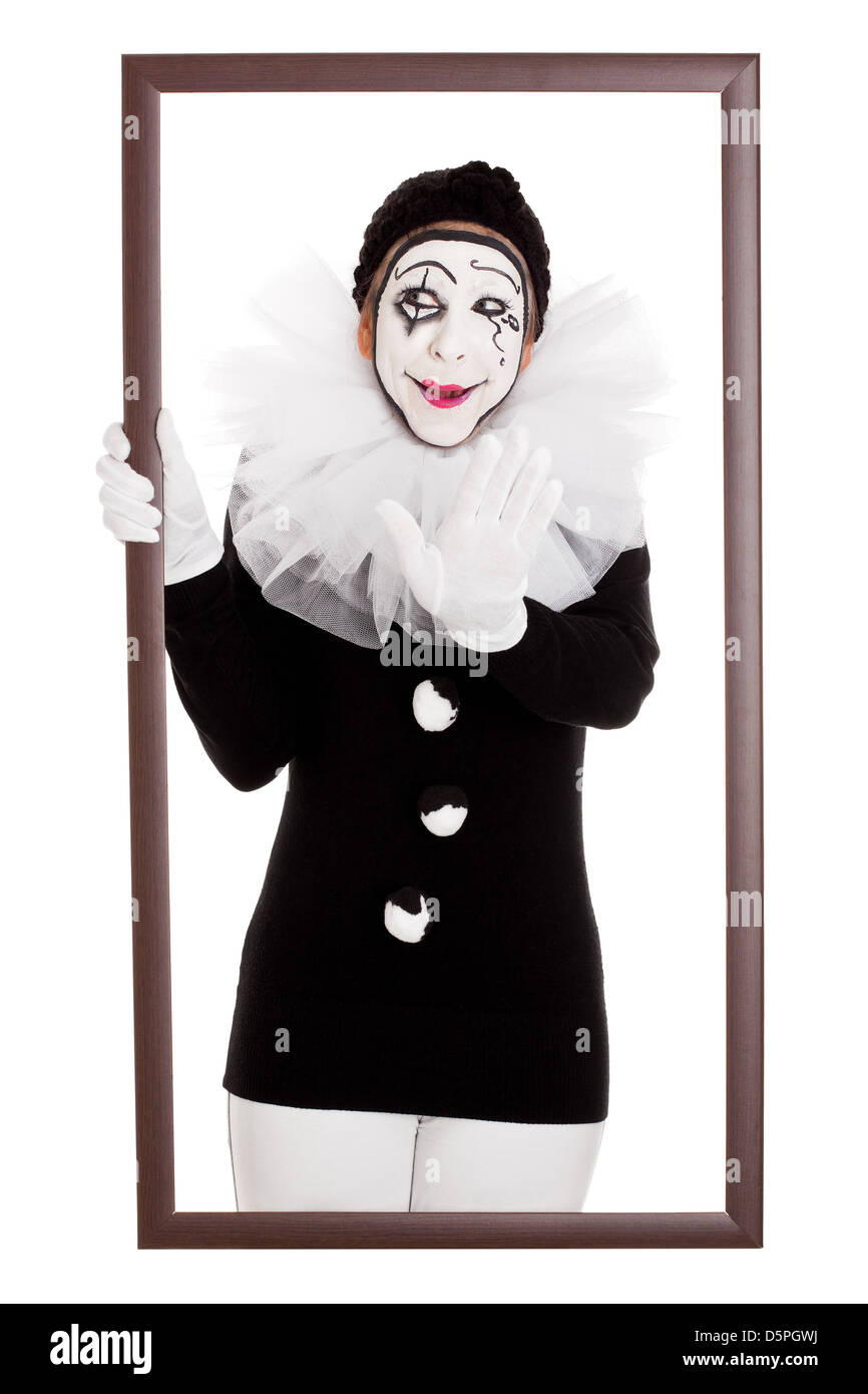 Clown femmina in un telaio si allunga la mano Foto Stock