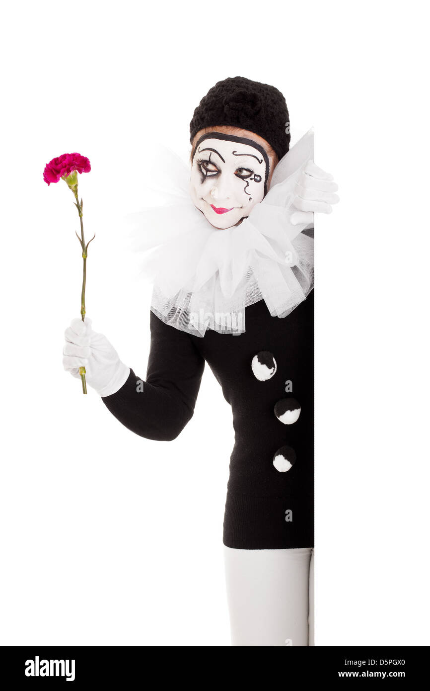 Bella femmina clown con fiore in mano Foto Stock