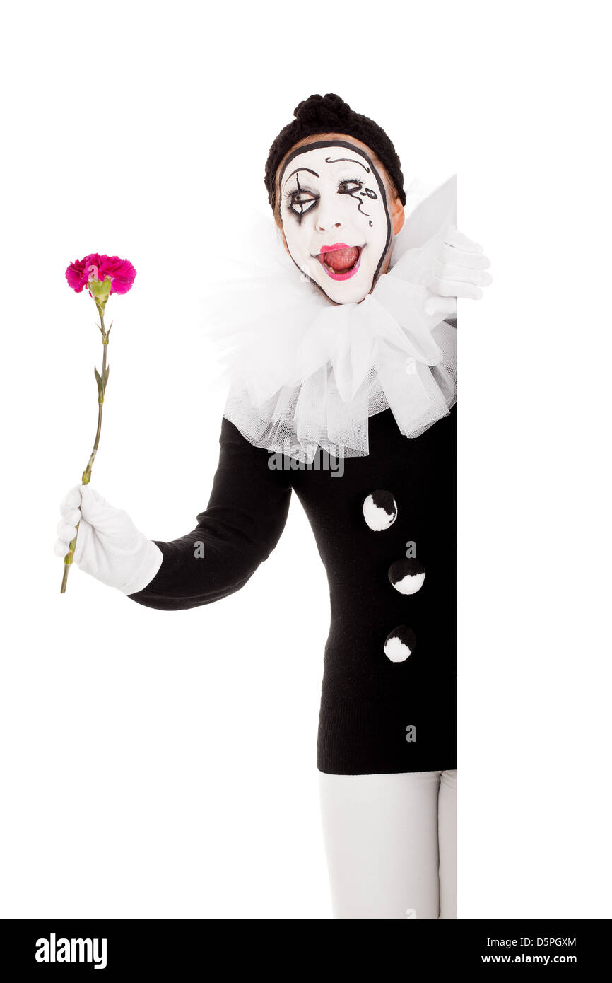 Divertenti clown femmina con fiore sembra felice Foto Stock