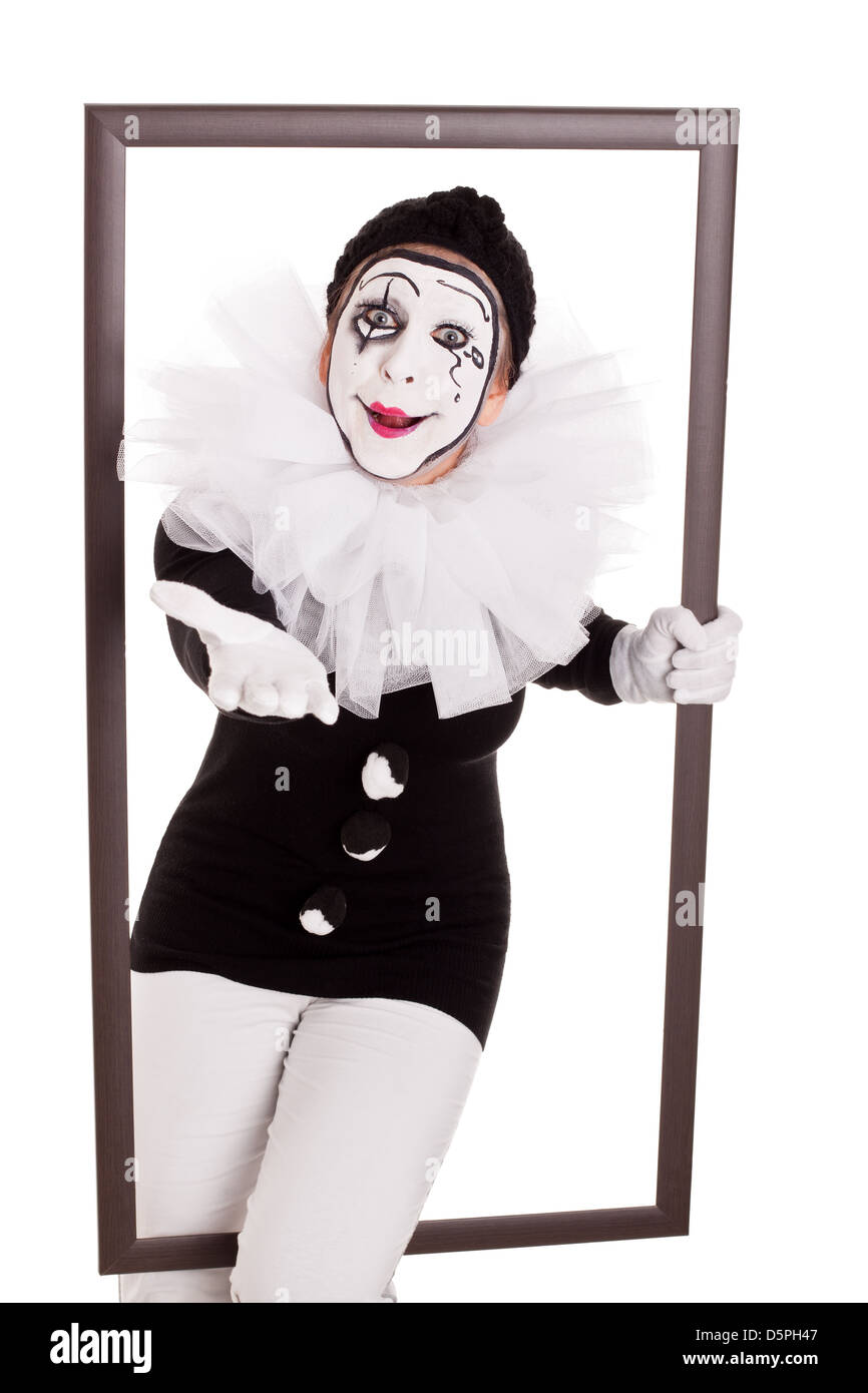 Clown femmina in un frame è di raggiungere la mano al visualizzatore Foto Stock