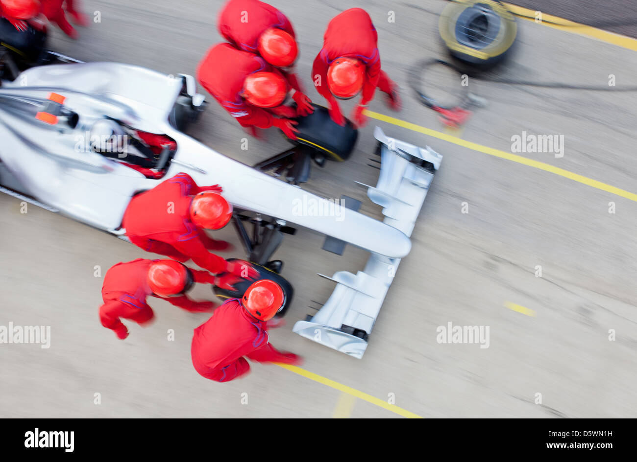 Racing team lavora al pit stop Foto Stock