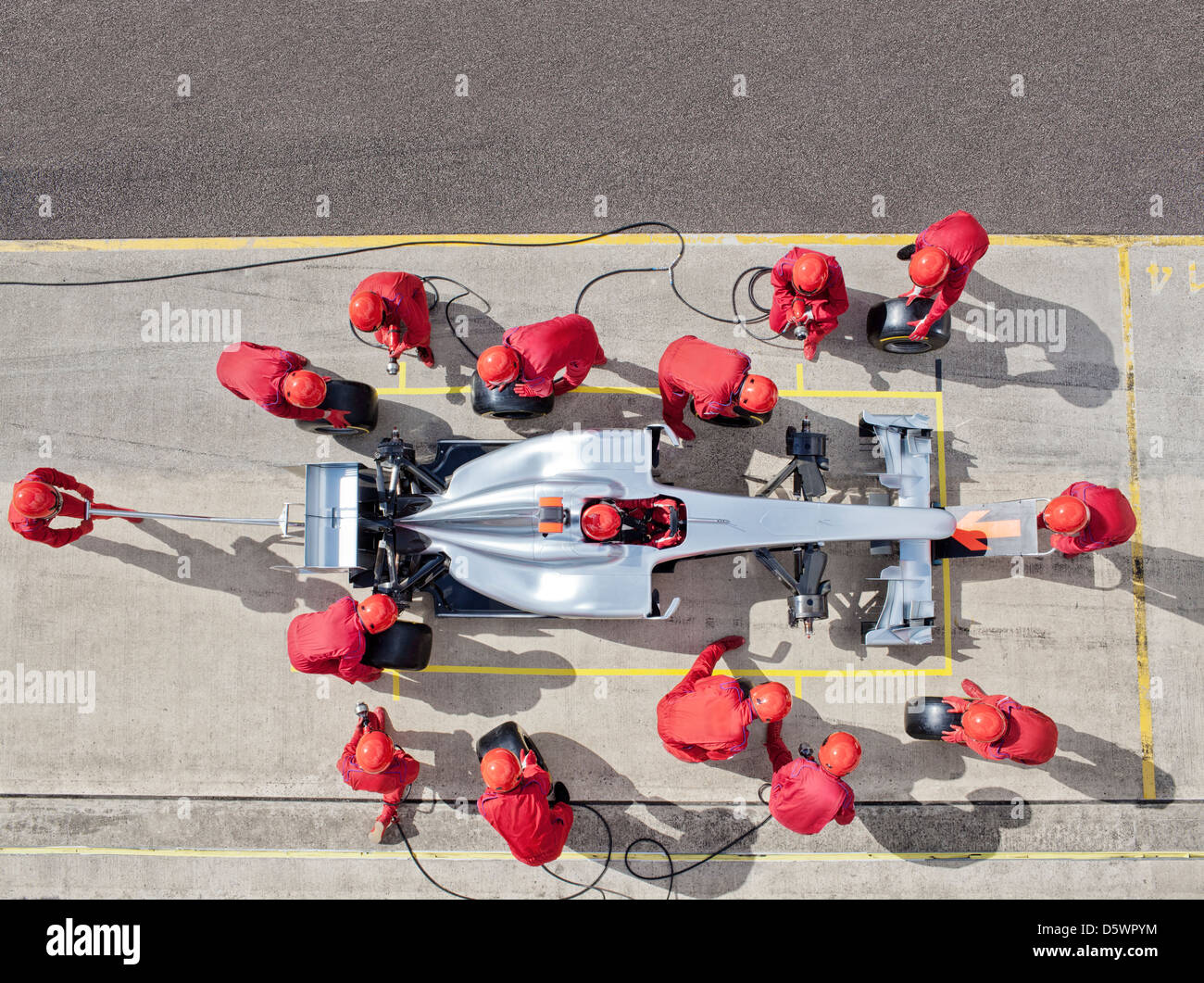 Racing team lavora al pit stop Foto Stock