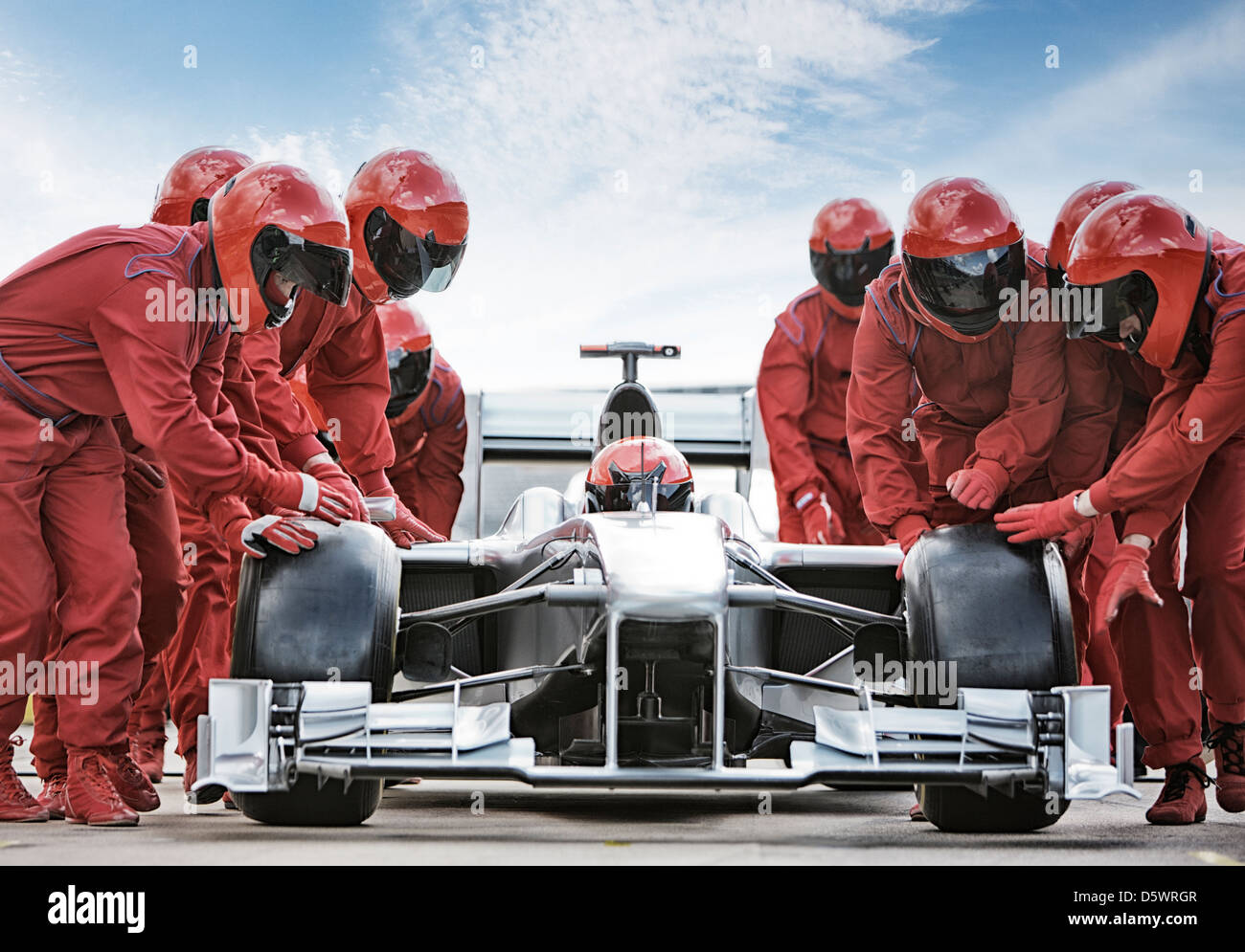 Racing team lavora al pit stop Foto Stock