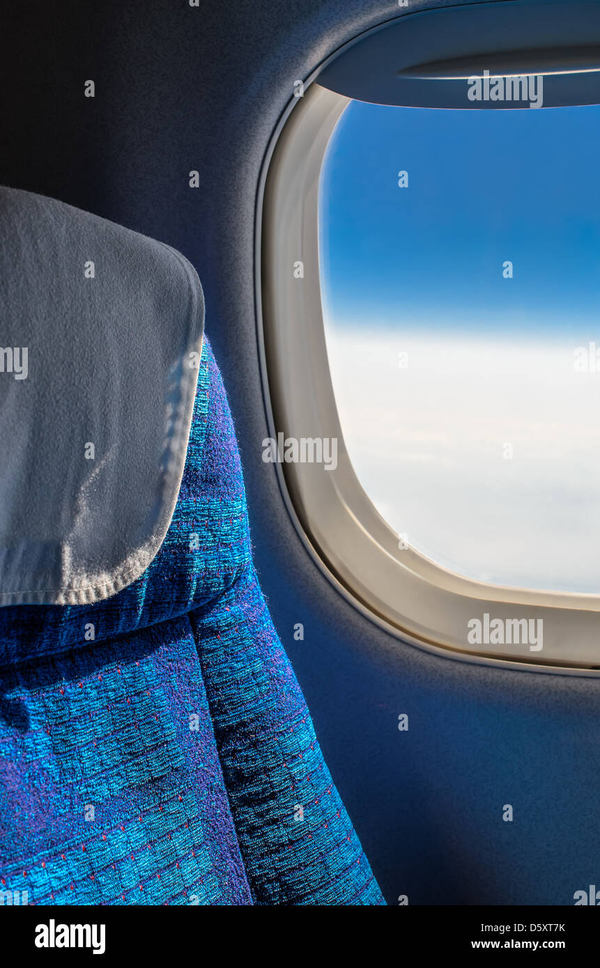 Sedi e la finestra in aereo Foto Stock