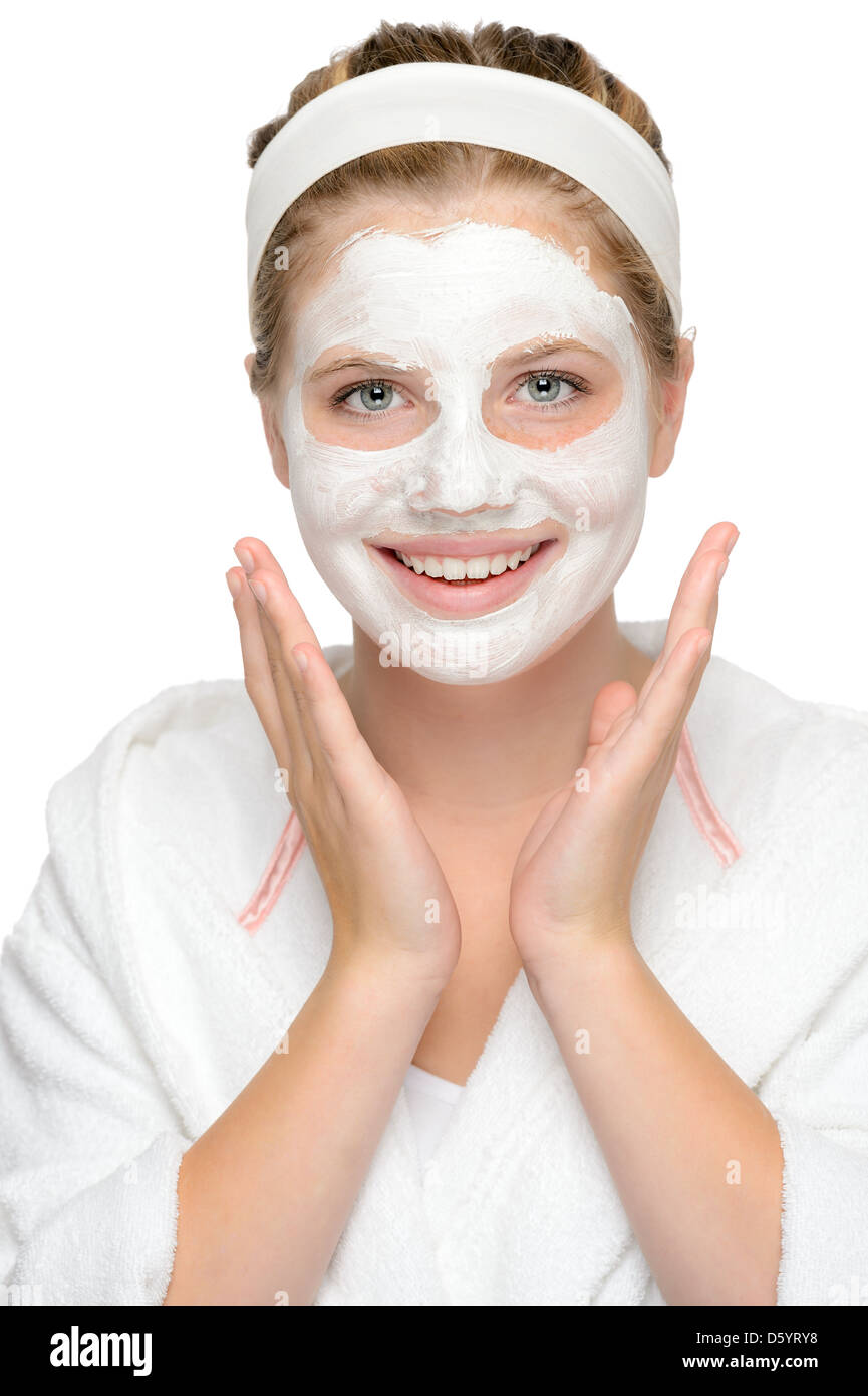 Felice giovane ragazza la maschera per il viso sorridente cosmetici crema di pulizia Foto Stock