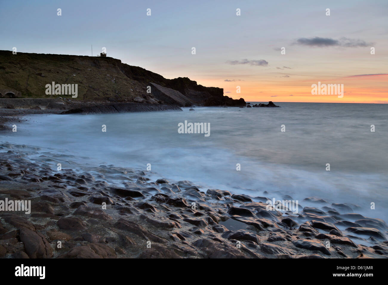 Bude; frangionde; tramonto; Cornovaglia; Regno Unito Foto Stock