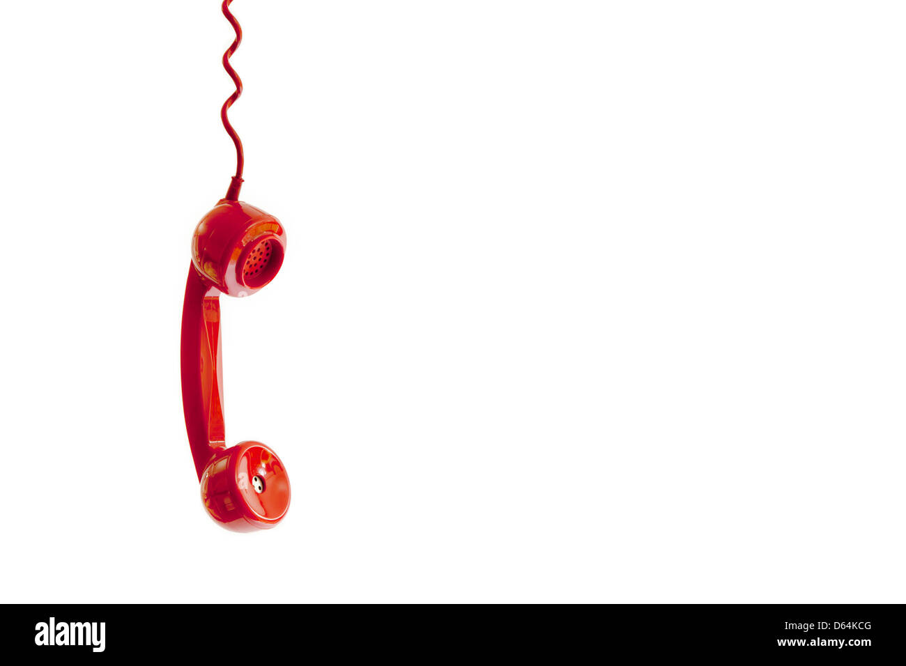 Un rosso ricevitore telefonico penzolante dal cavo. Foto Stock