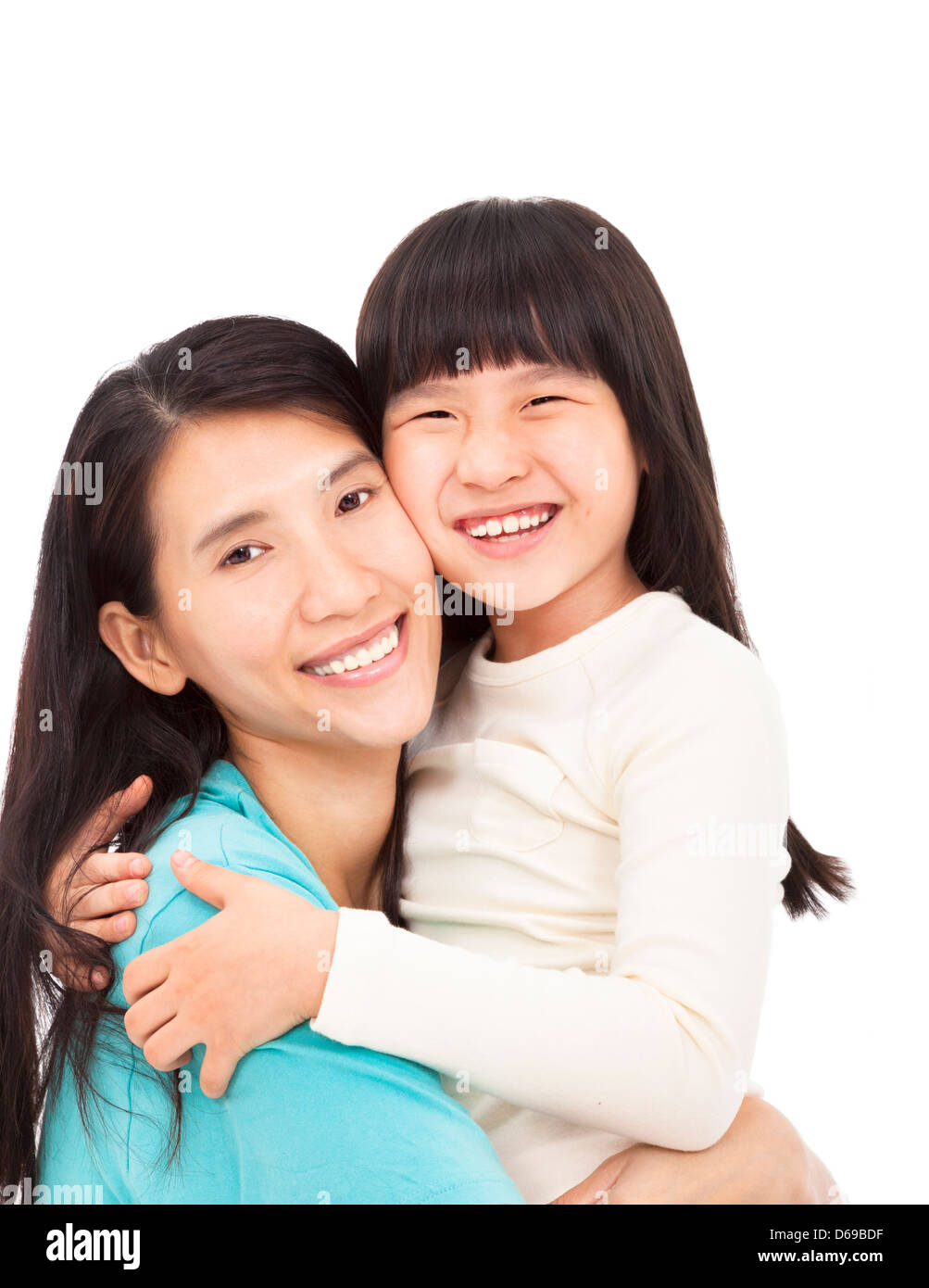 Felice bambina abbracciando con sua madre Foto Stock