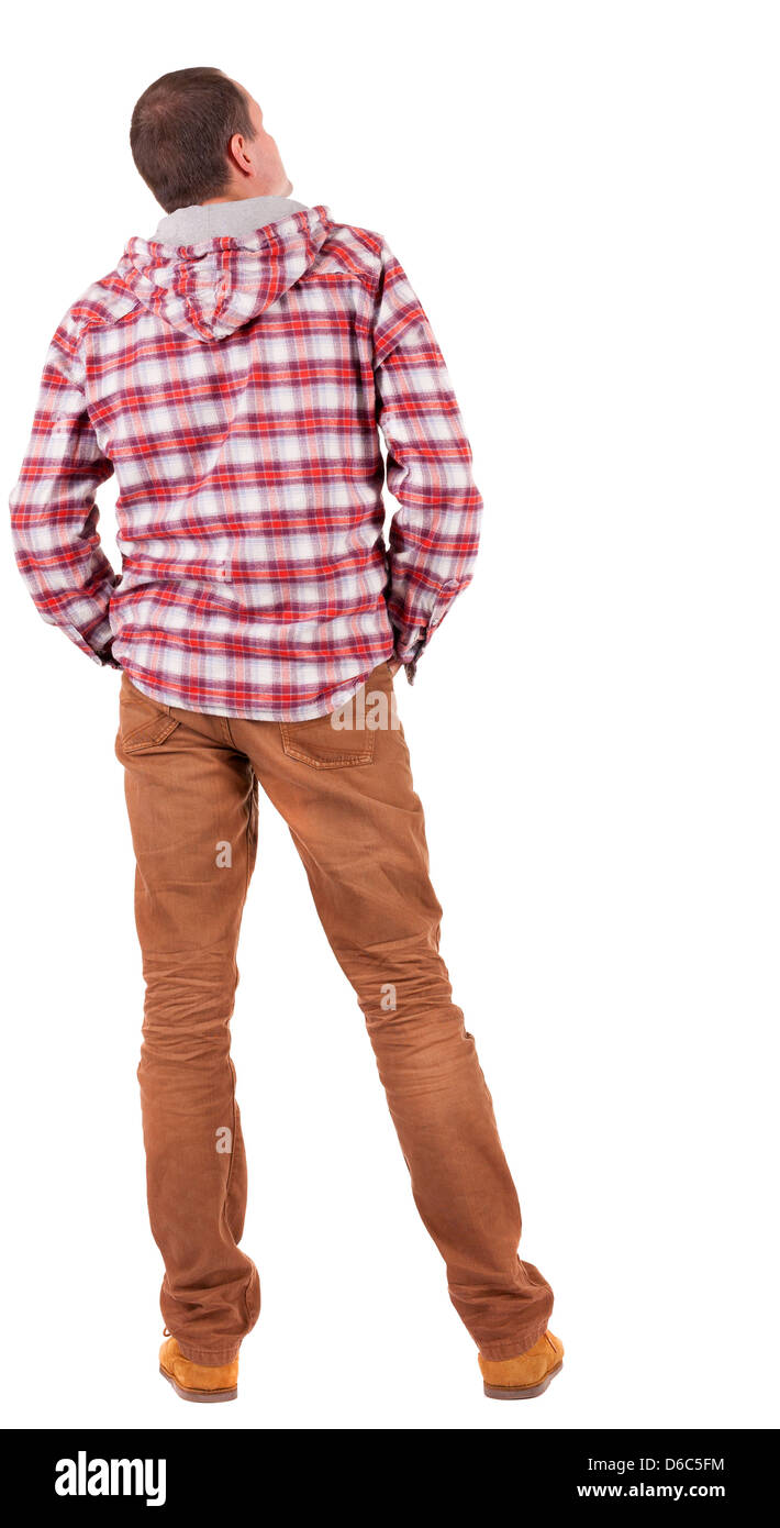 Vista posteriore del ragazzo in un plaid shirt con cappa cercando. In piedi giovane uomo in jeans e giacca. Vista posteriore di raccolta di persone. Foto Stock