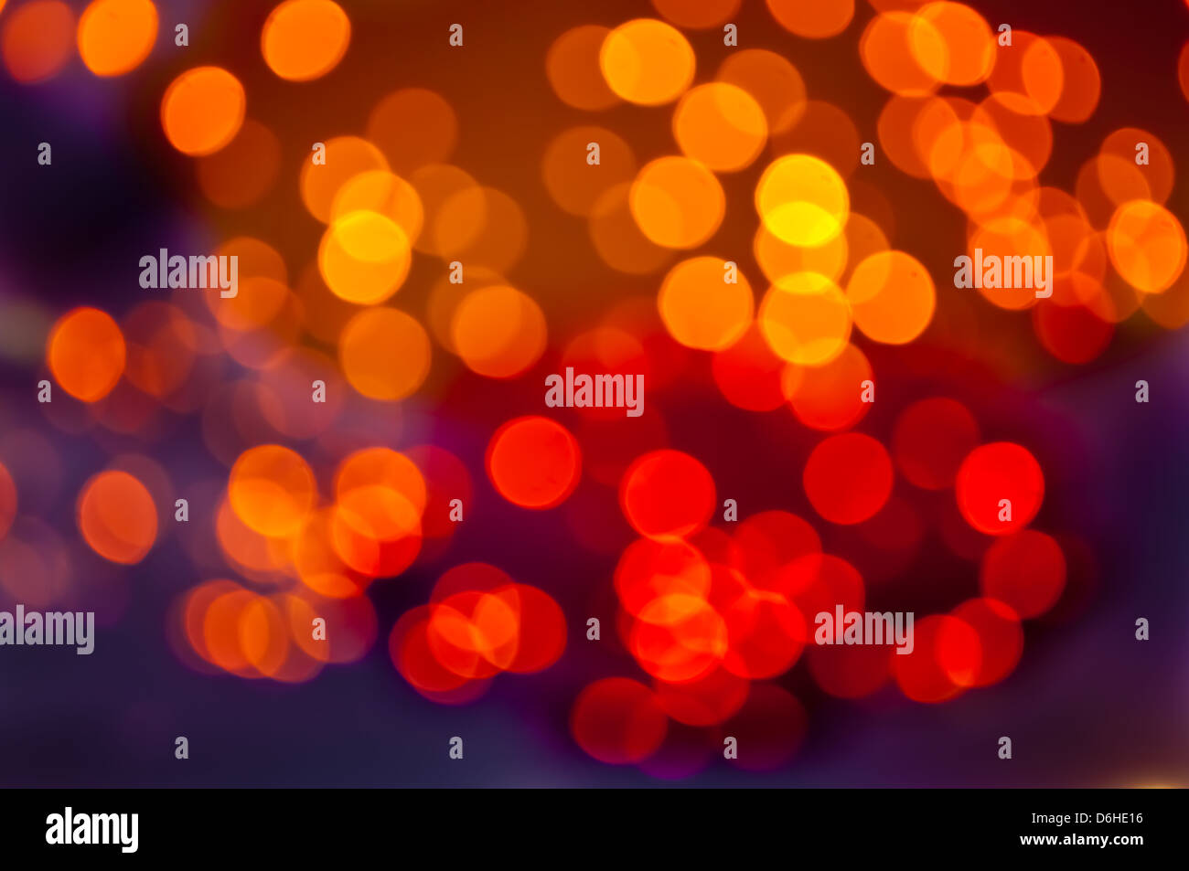 L'abstract del cerchio rosso e arancio luce sfondo bokeh di fondo Foto Stock