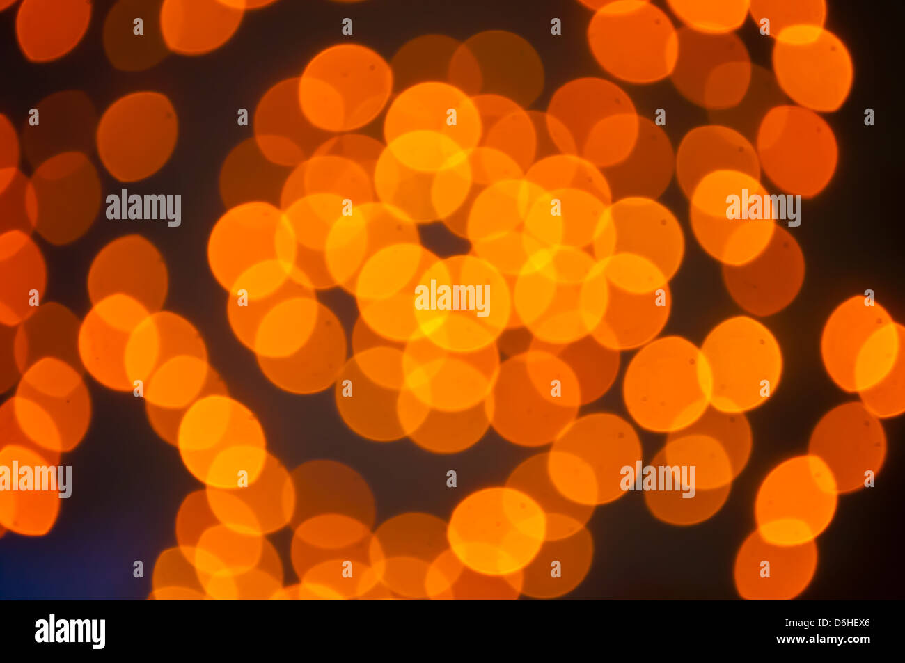 L'abstract del cerchio di luce arancione sfondo bokeh di fondo Foto Stock