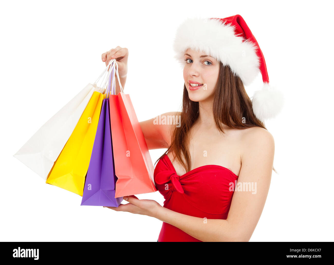 Pretty girl nel cappello di Natale con colorati borse per lo shopping Foto Stock