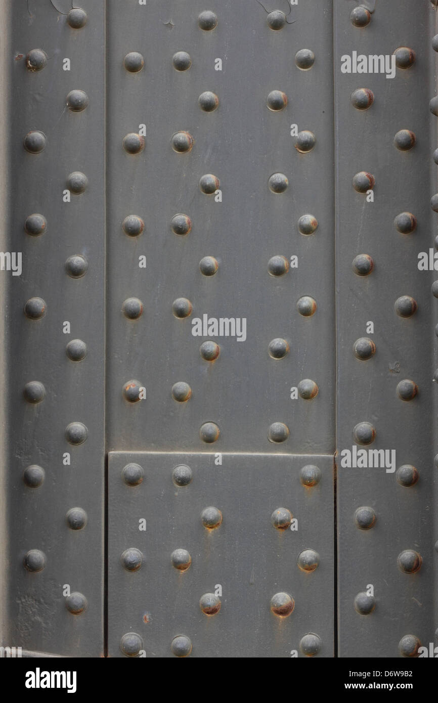 Un acciaio rivettato sfondo della piastra Foto Stock