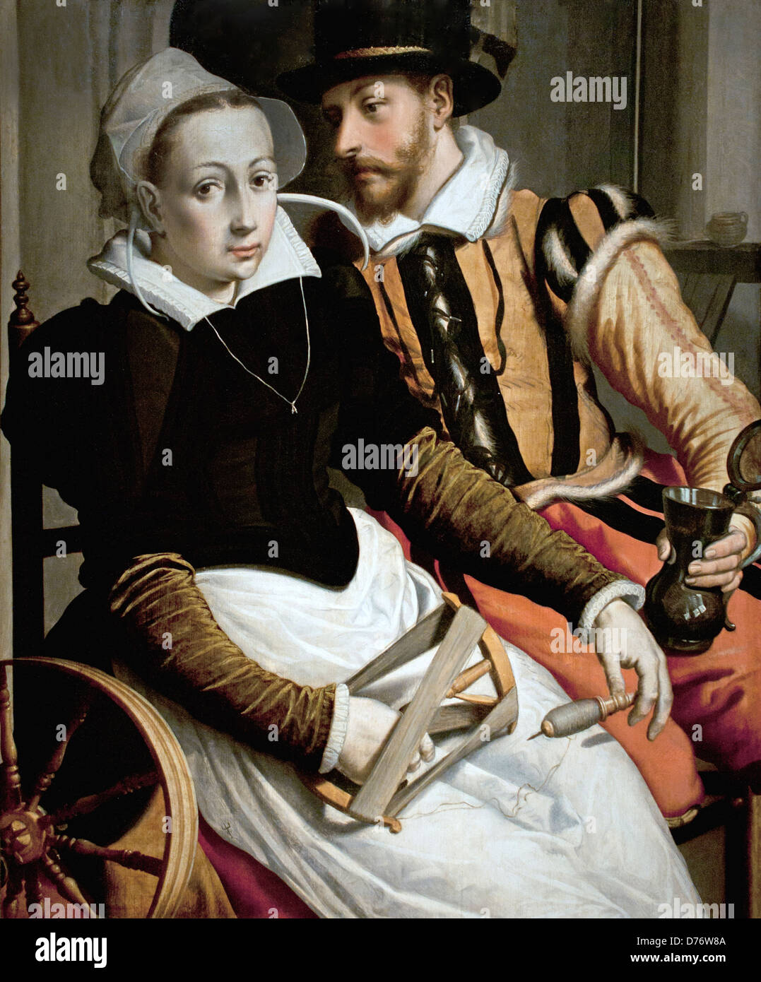 Una donna alla ruota di filatura e di un uomo con una tazza alloggiato in un interno.1560 Pieter Pietersz il sambuco olandese Paesi Bassi Foto Stock