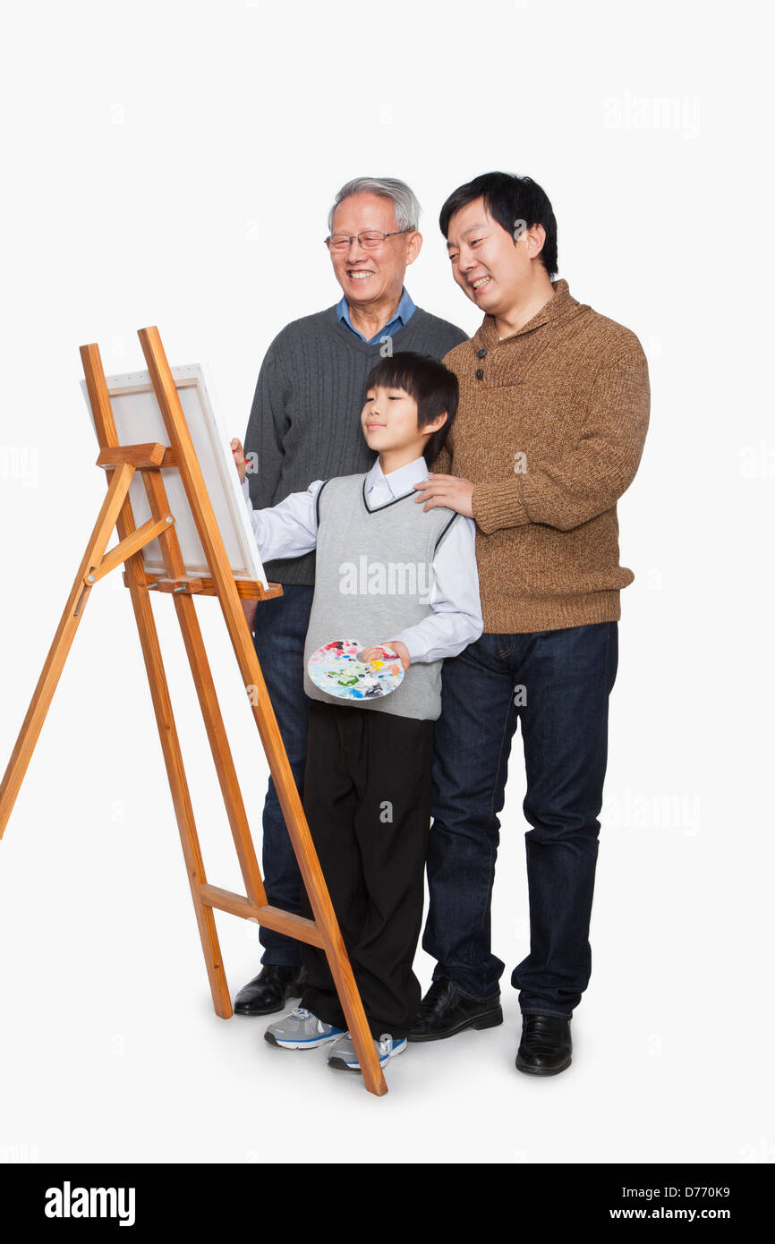 Pittura del ragazzo con il padre e il nonno Foto Stock