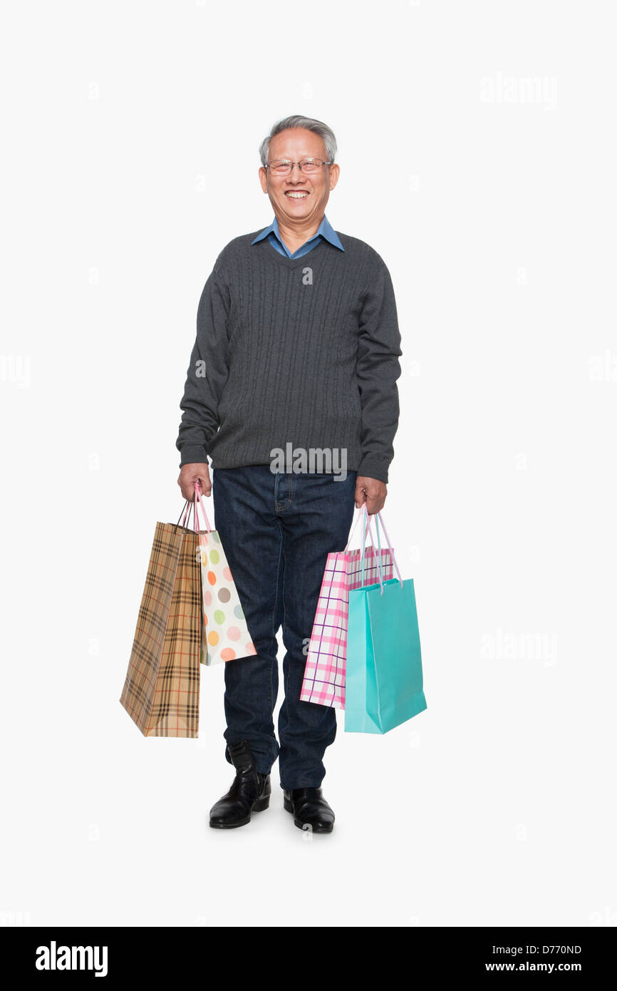 Senior uomo con borse per lo shopping Foto Stock