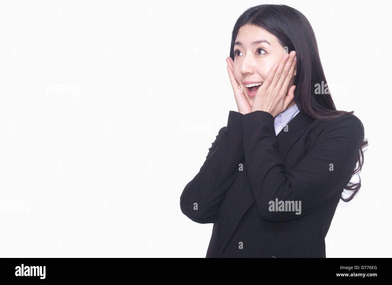 Imprenditrice con le mani sulla faccia che agisce sorpreso Foto Stock
