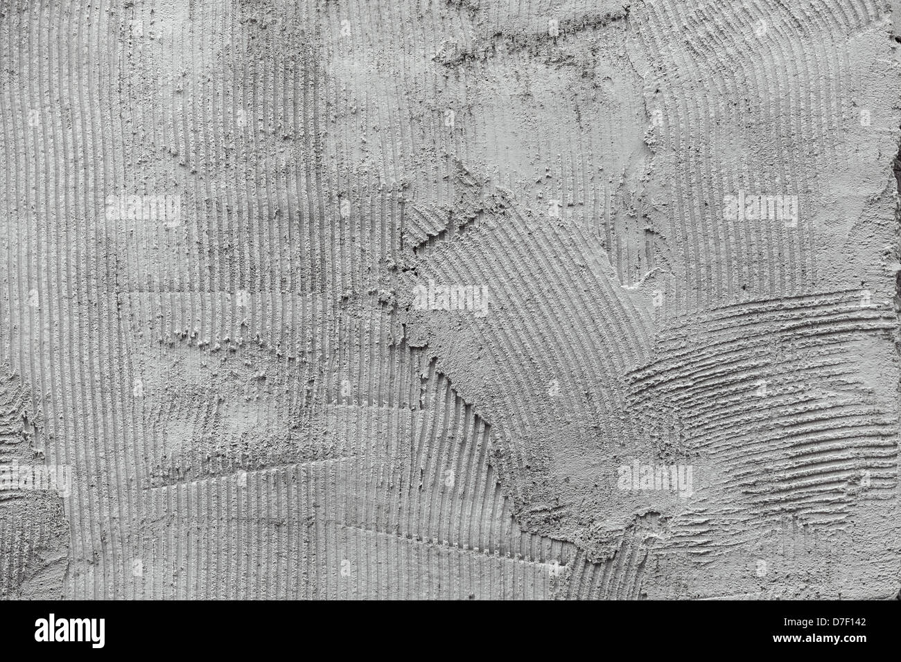 Muro grigio colla pettine in gesso superficie preparata per rivestimenti Foto Stock