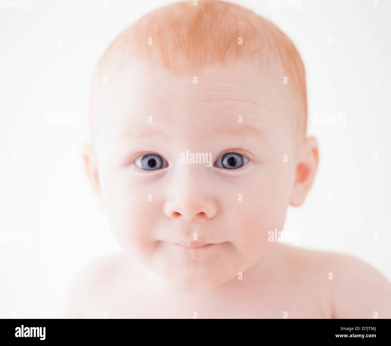 Studio shot ritratto di sorpresa baby boy (18-23 mesi) Foto Stock