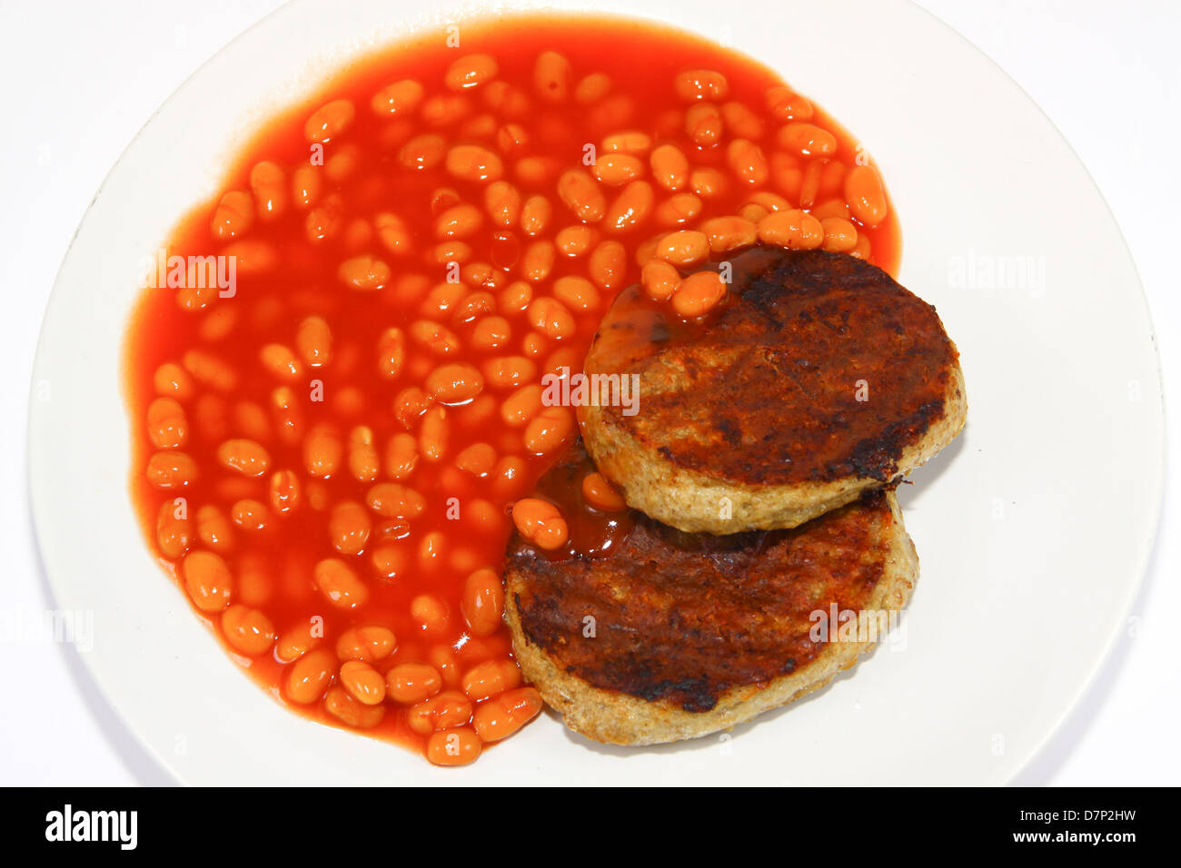 Gli hamburger e fagioli su piastra Foto Stock