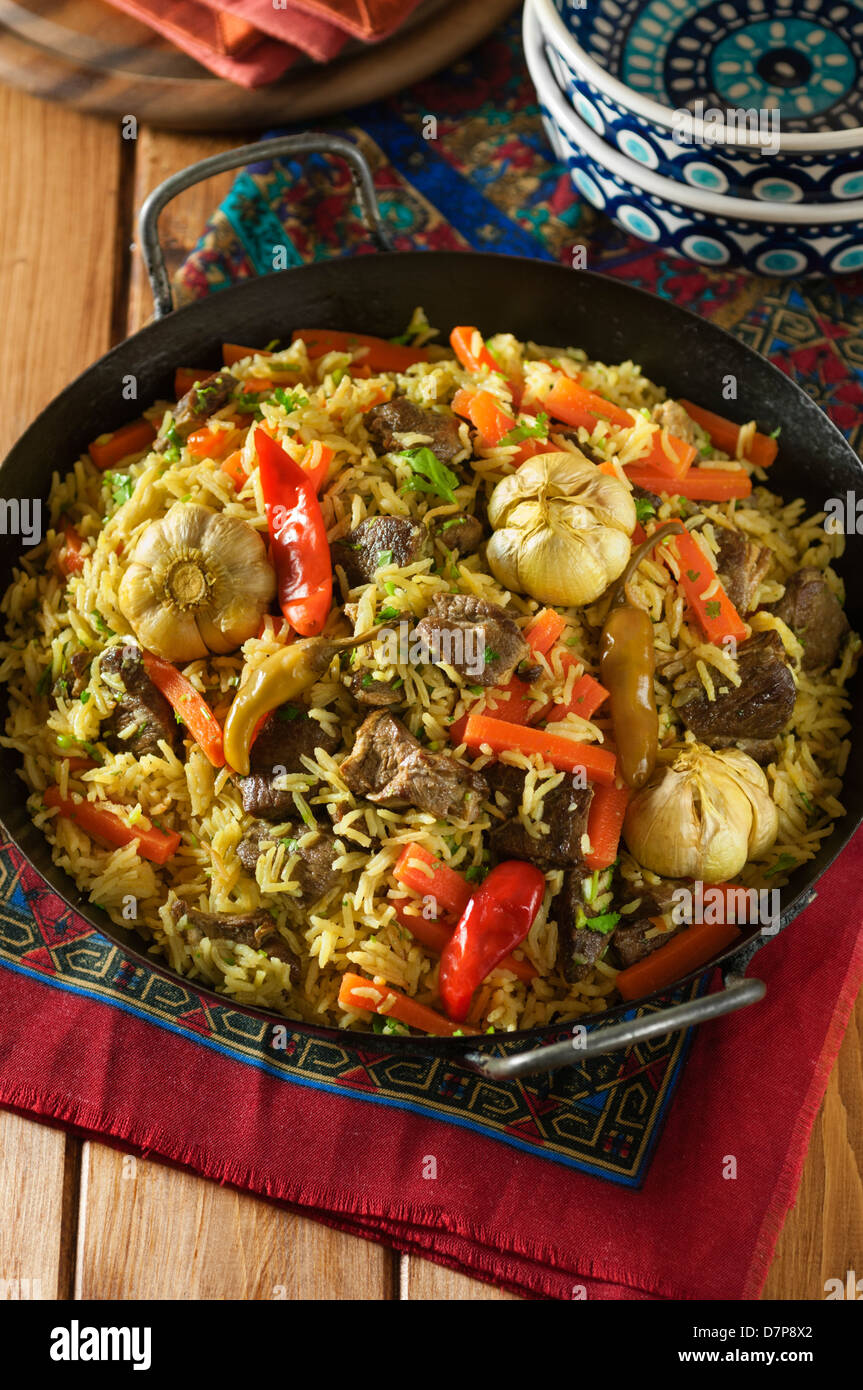 Plov agnello e riso pilaff Asia Centrale cibo Foto Stock