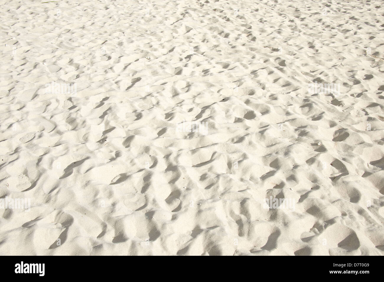 La sabbia della spiaggia tropicale come sfondo Foto Stock