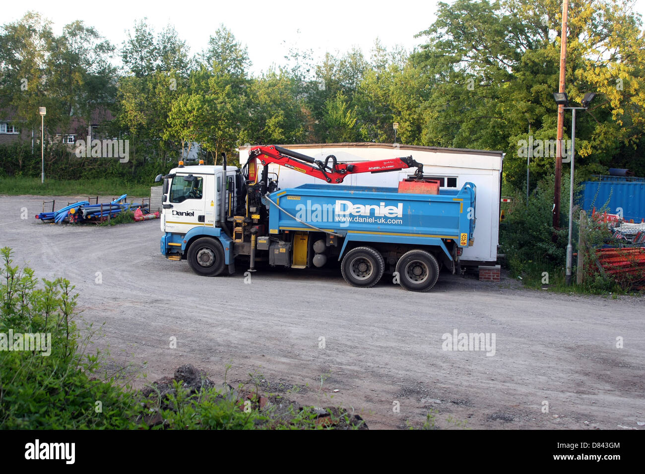 Il carrello è stato parcheggiato per il weekend appartenenti a Daniele Costruzione di una società attualmente in difficoltà finanziarie, Maggio 2013 Foto Stock