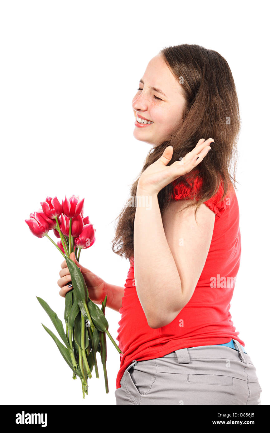 La ragazza ridere con fiori dice addio con il gesto di una mano Foto Stock