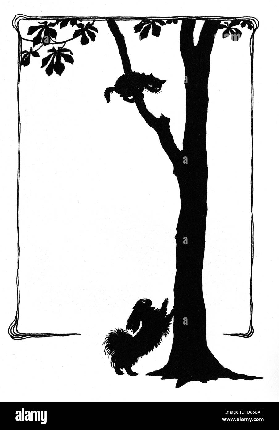 Koko il cane spaventa un gattino in un albero Foto Stock