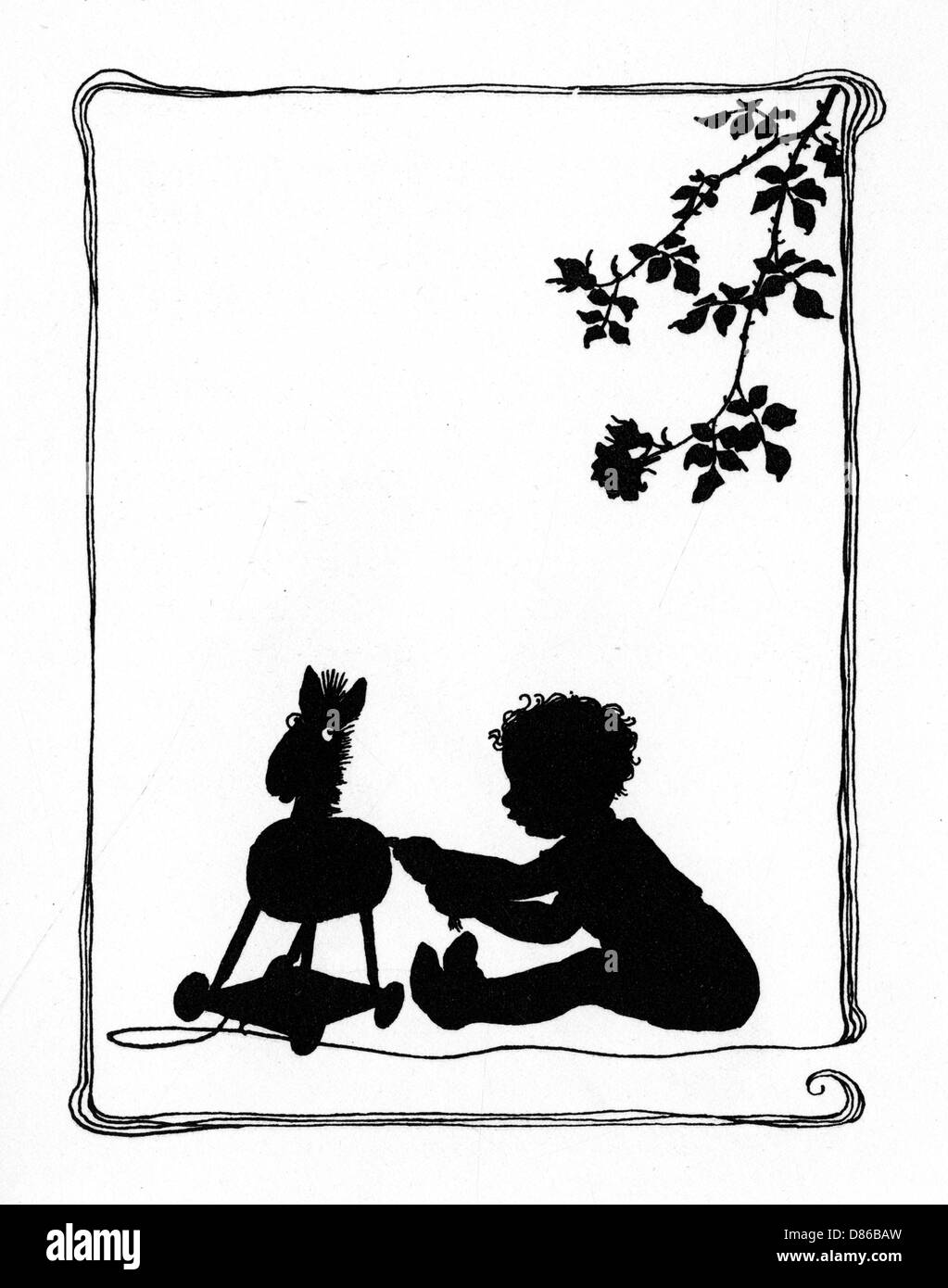 Bambino che gioca con un cavallo giocattolo Foto Stock