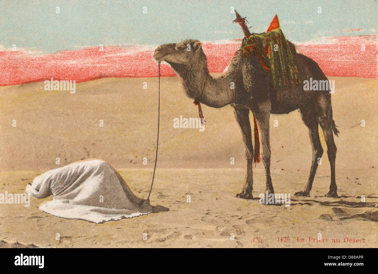 PREGARE NEL DESERTO Foto Stock
