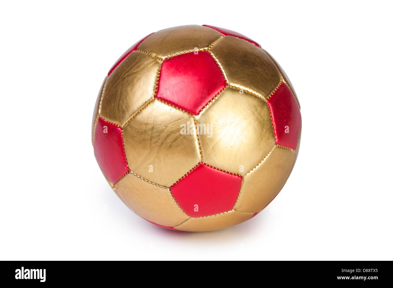 Rosso e oro futbool pallone da calcio Foto Stock