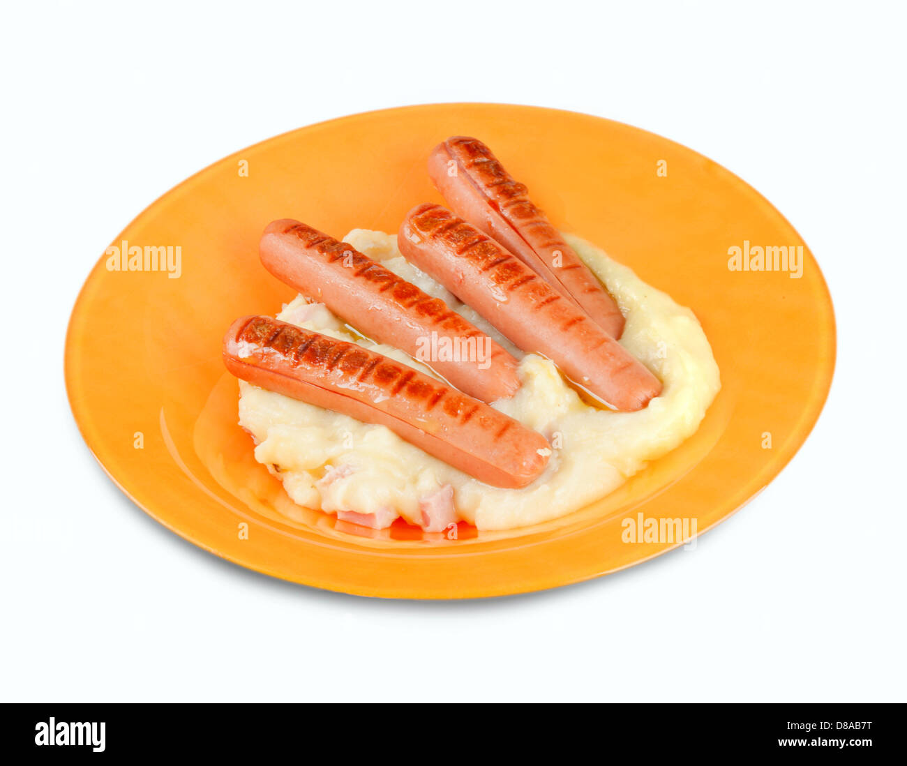 Salsicce con purea di patate nel piatto arancione Foto Stock