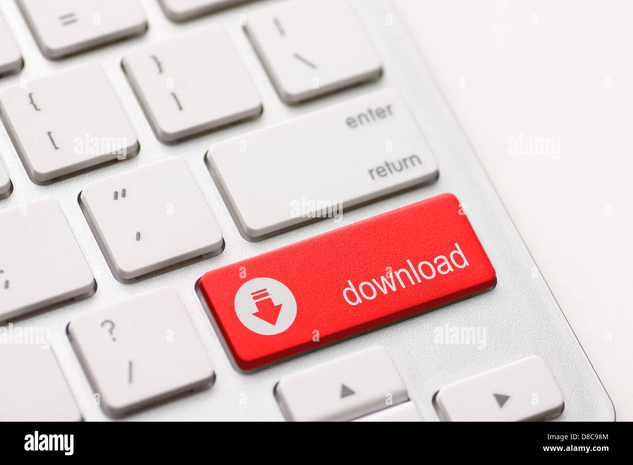 Un download pulsante invio chiave. Foto Stock