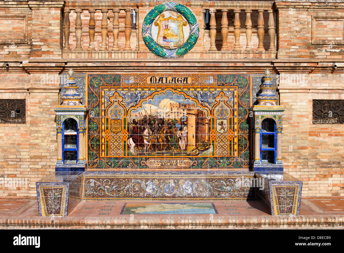 Conquista di Malaga il dipinto Azulejos piastrelle ceramiche in Plaza de Espana in Siviglia Andalusia regione. Foto Stock