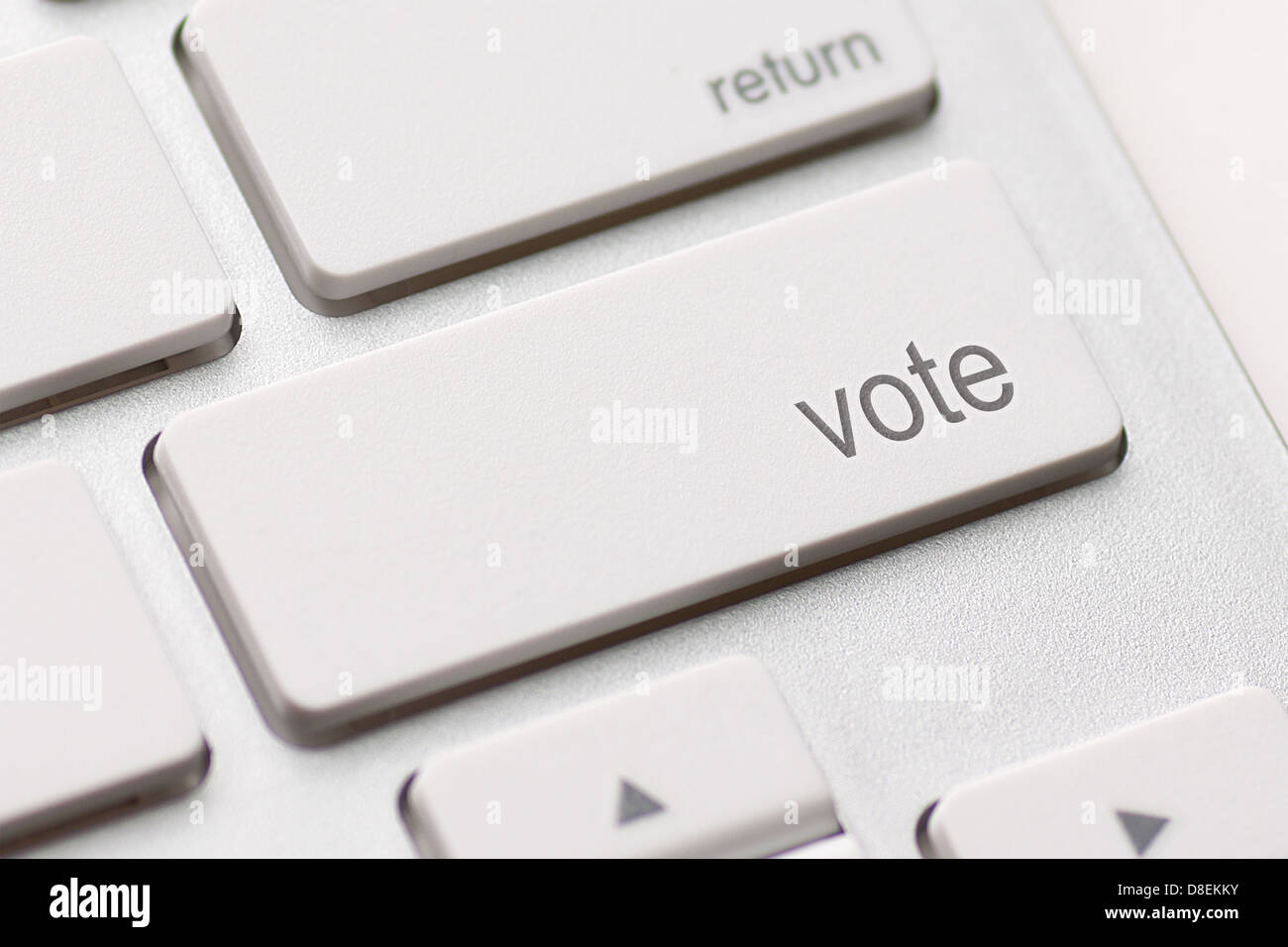 Il concetto di democrazia con pulsante di votazione sulla tastiera Foto Stock