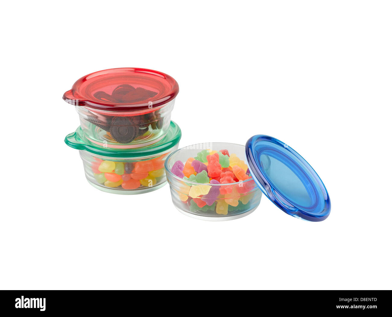 I tre colori di ciotole in vetro con coperchio in plastica per lo stoccaggio di alimenti in cucina Foto Stock