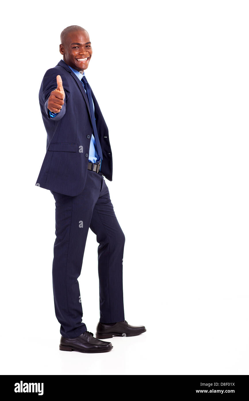 Bello African American businessman in tuta dando pollice in alto Foto Stock