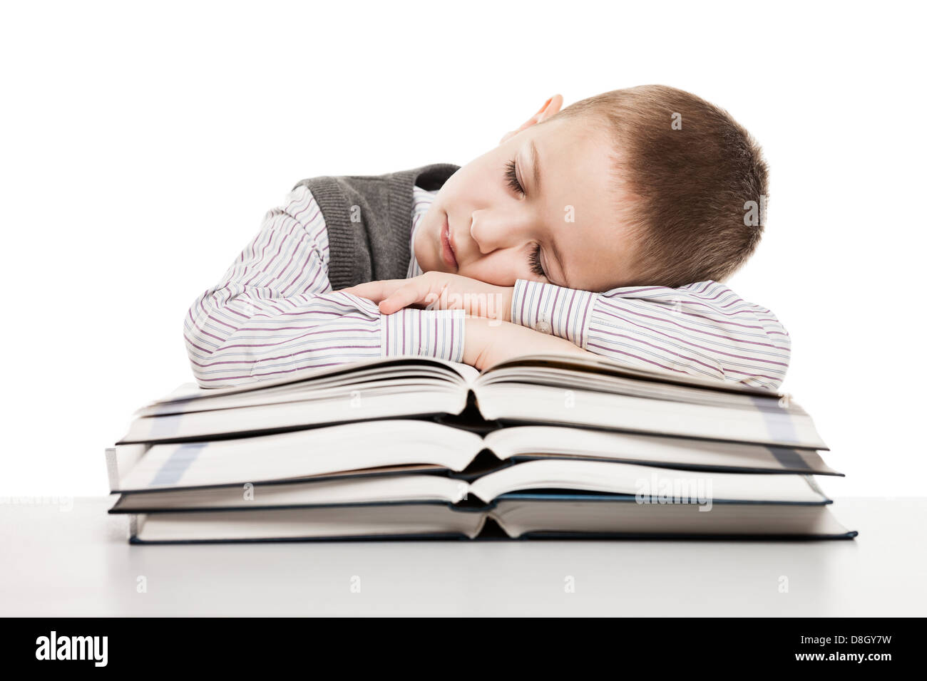 Bambino che dorme sulla lettura di libri Foto Stock