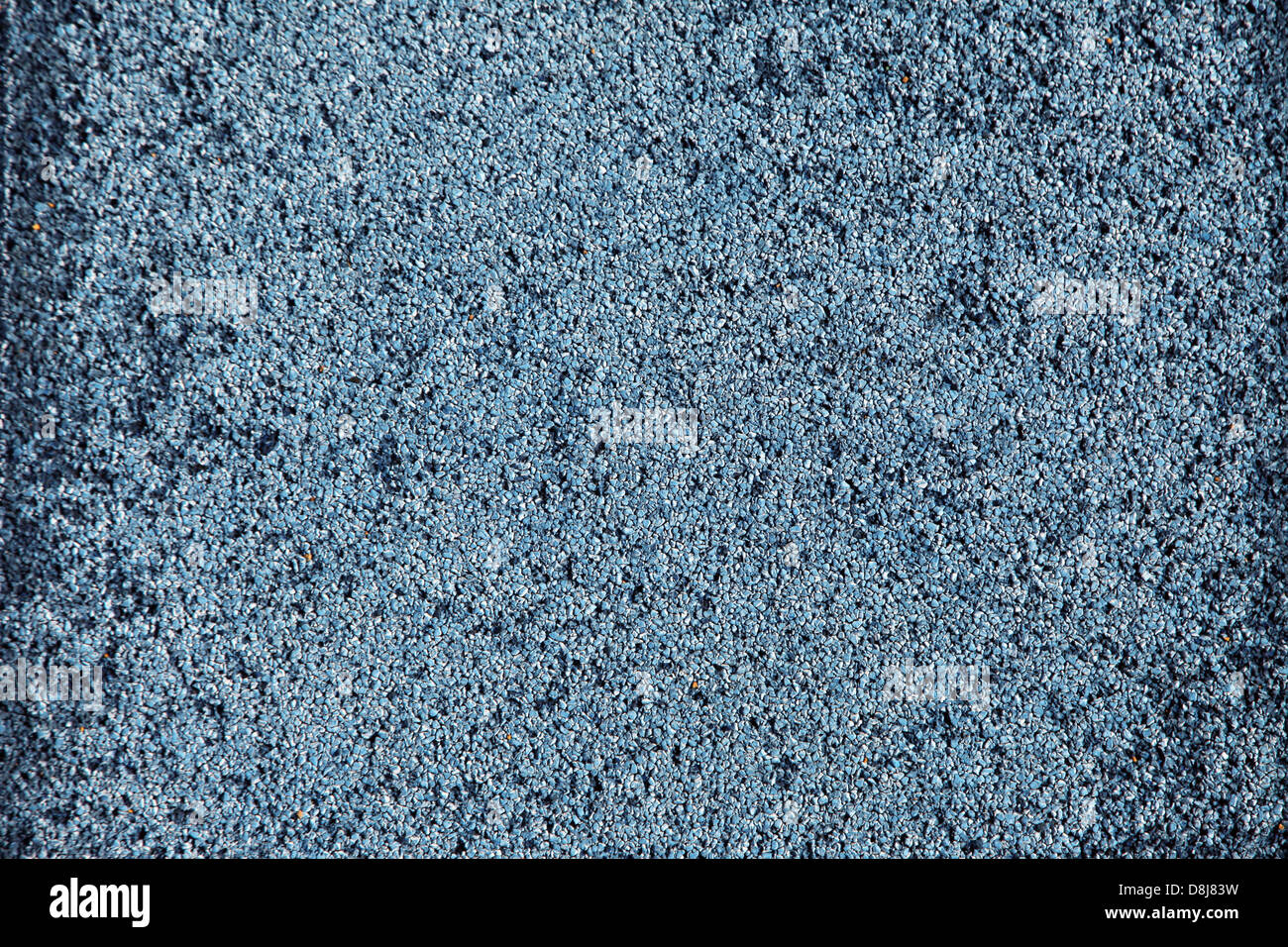 Si tratta di una foto di un close-up delle texture sintetica di un campo da tennis. è in colore blu con un aspetto piuttosto ruvida. Foto Stock