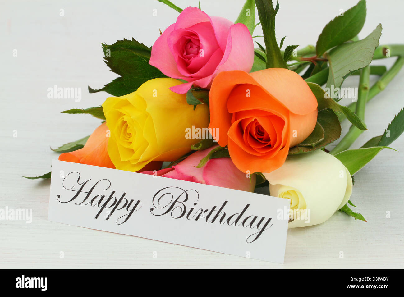 Buon compleanno nota e colorati mazzo di rose Foto stock - Alamy