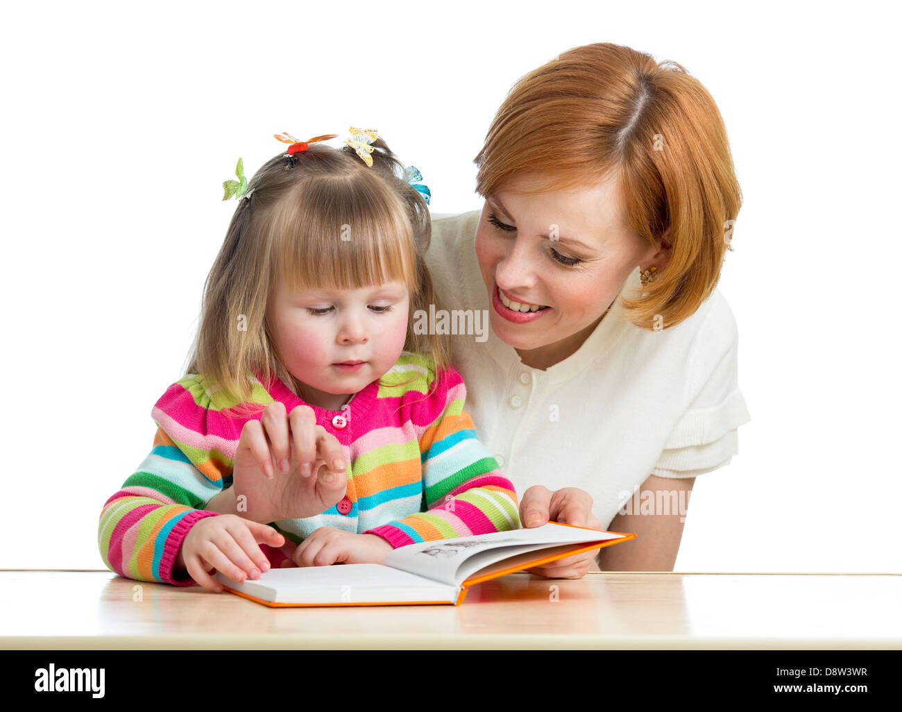Madre la lettura di un libro bambino Foto Stock