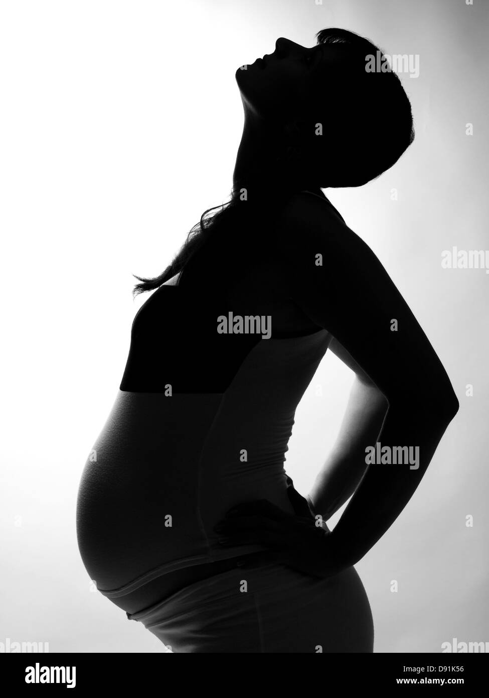 Silhouette di una donna in stato di gravidanza Foto Stock