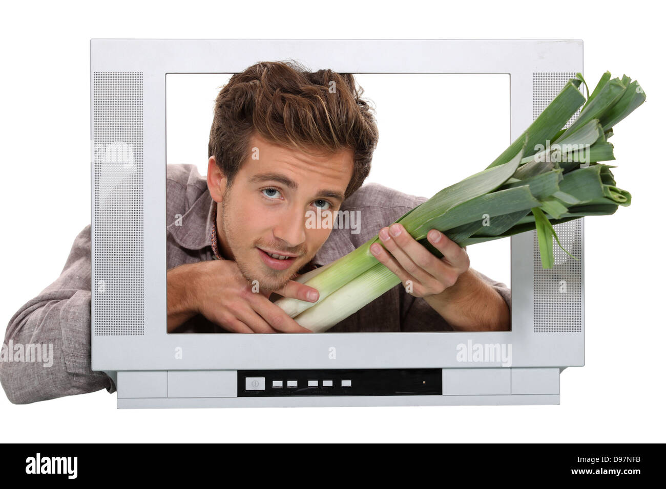 Un uomo che dà i porri attraverso un schermo Foto Stock