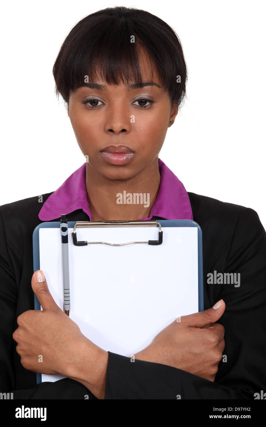 Imprenditrice afro-americana tenendo un blocco note Foto Stock