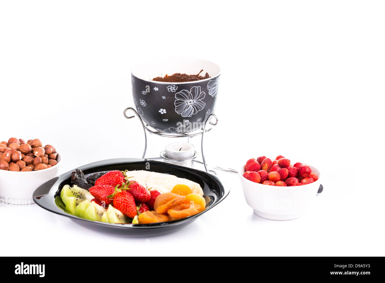 La Fonduta di cioccolato con frutta isolato su sfondo bianco Foto Stock