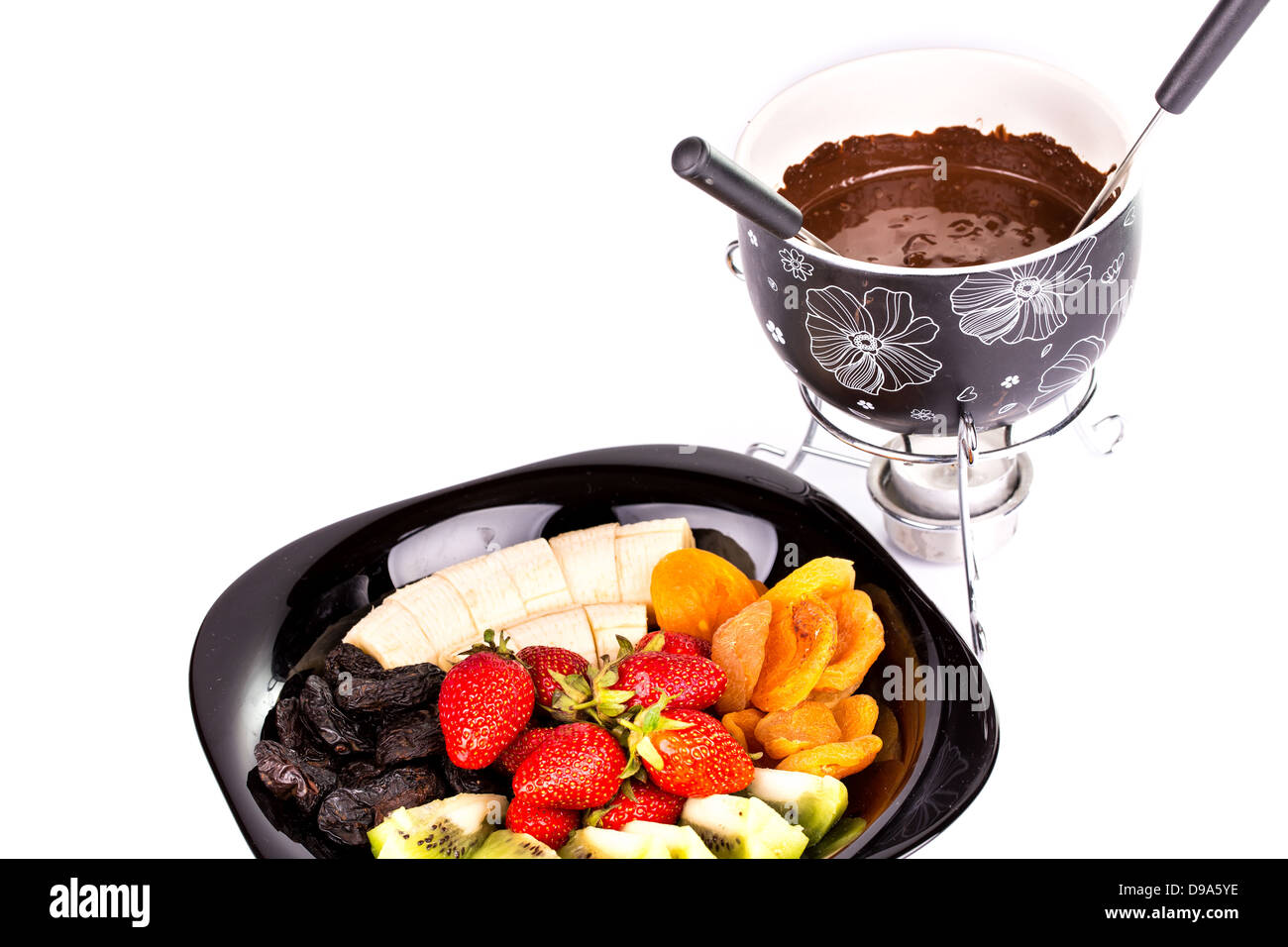 La Fonduta di cioccolato con frutta isolato su sfondo bianco Foto Stock