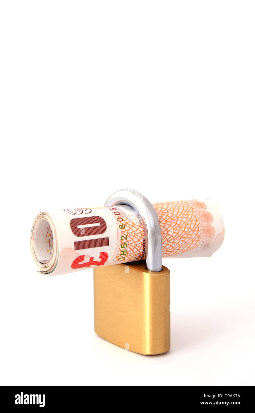 Arrotolato dieci pound nota in una serratura Foto Stock