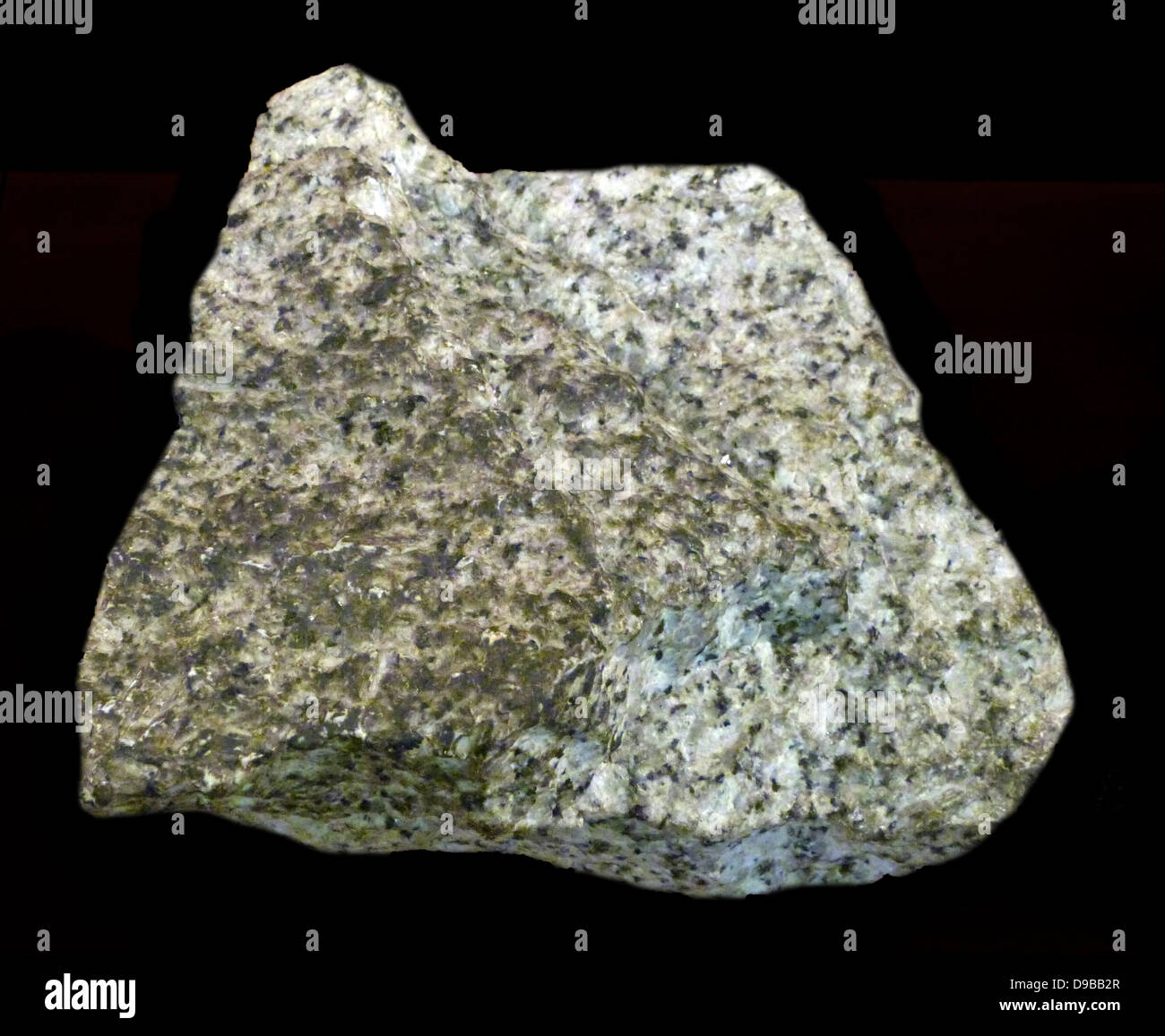 Granito - è una comune e ampiamente ricorrenti di tipo intrusivo, felsic, rocce ignee. Il granito di solito ha un a grana grossa consistenza. Di tanto in tanto alcuni singoli cristalli sono più grandi della groundmass, nel qual caso la texture è noto come porphyritic. Una roccia con questa texture è talvolta noto come porfido. Graniti può essere rosa al di colore grigio. Foto Stock