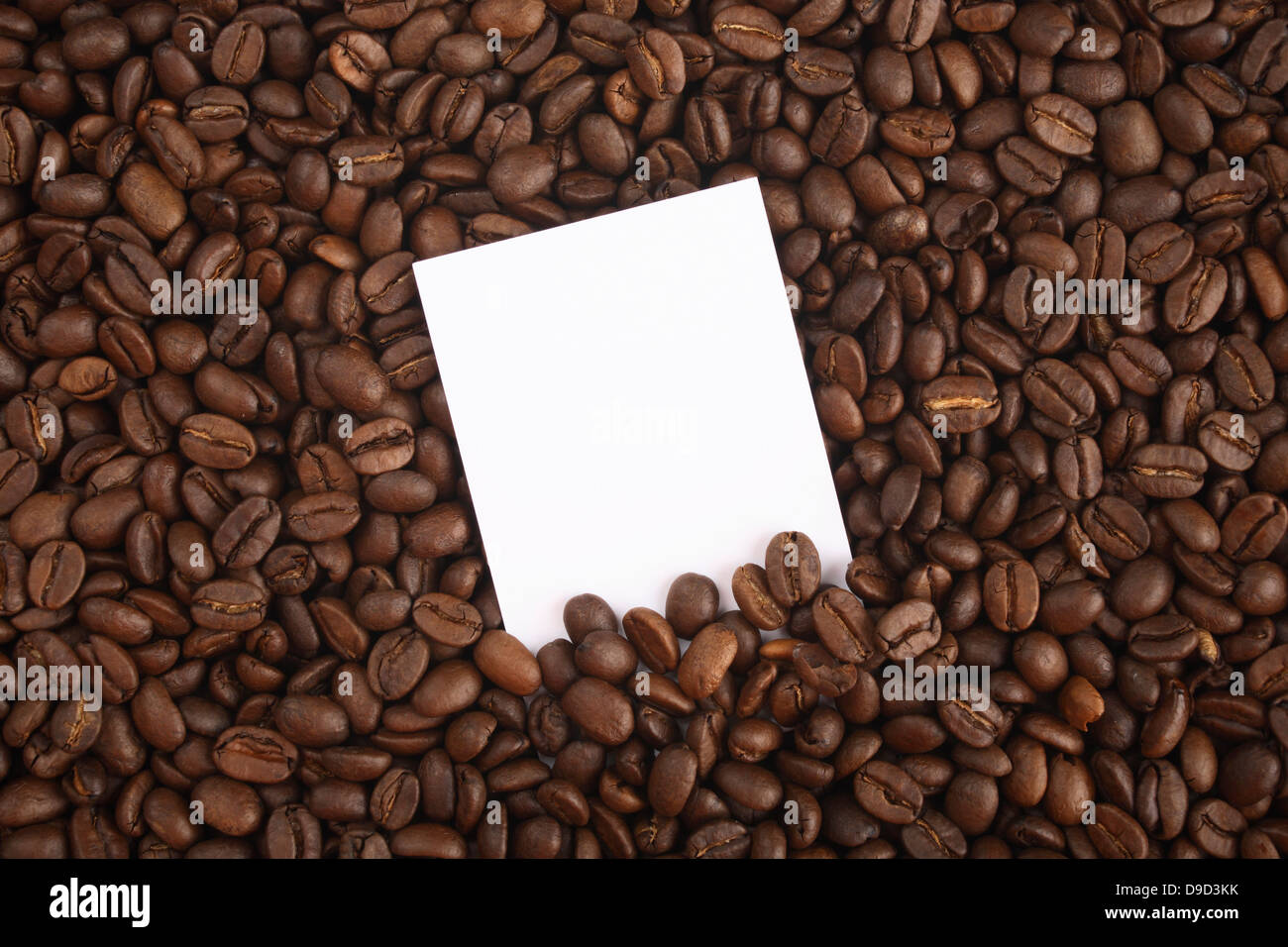I chicchi di caffè con nota slip di carta Foto Stock